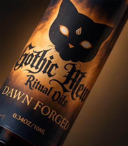 The Dawn Forged label: a black cat on an orange and black gradient